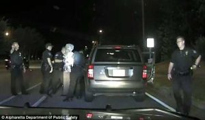 The shocking moment a Georgia police officer drags a crying 65-year-old grandmother from her car during a traffic stop