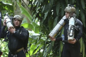 Rescuers race to drain water inside Thai cave before rains
