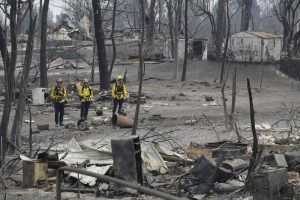 California wildfires claim more lives; crews make progress
