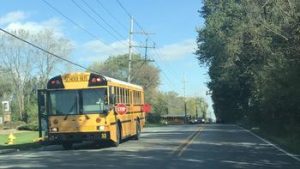 24-year-old woman charged in death of 3 siblings killed by truck at Indiana bus stop