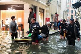 11 DEAD FROM STORMS. WORST FLOODS IN A DECADE SWAMP THREE-QUARTERS OF VENICE, ITALY