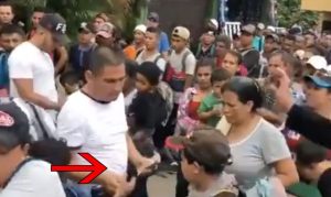 VIDEO: SOMEONE IS HANDING OUT STACKS OF CASH TO THE MIGRANTS HEADED TO THE UNITED STATES