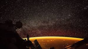 The ORANGE planet: Stunning NASA image from the International Space Station shows Earth enveloped in a rare ‘airglow’
