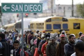 Migrant caravan groups arrive by hundreds at US border