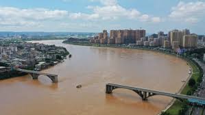 Bridge in China collapses, sending vehicles into river