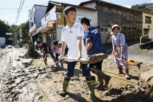 Rescuers slog through mud as Japan typhoon death toll rises to 66