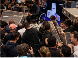 Black Friday chaos sweeps the world with fights, stampedes and gun scares at shopping centre