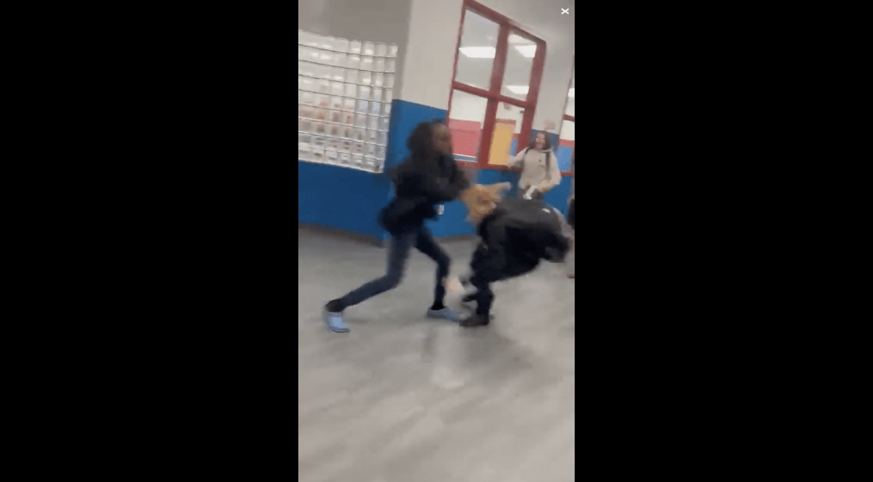 DEMONIC: Middle School student drags fellow pupil to the ground and repeatedly bangs her head on the floor in front of crowd who are barking and cheering