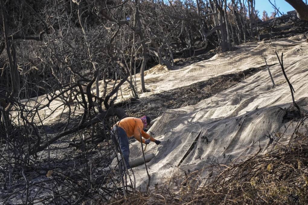 Rain Helps Southern California Firefighters But Sends Ash and Mud Flowing Down Hillsides