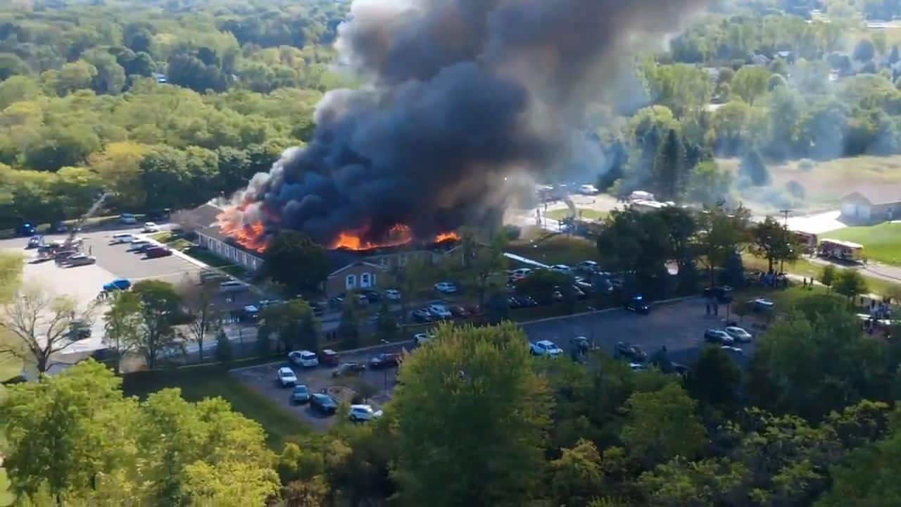 Gunman rams vehicle through front of church and opens fire killing at least 2 and wounding 9 others in Michigan